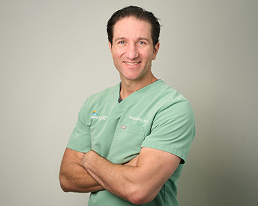 Dr. David Robbins in patient consultation at INTIMÉ Miami in North Miami